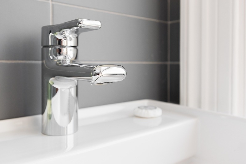 A bathroom tap close up shot.