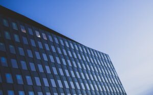 Modern glass office building representing Capital Law headquarters.