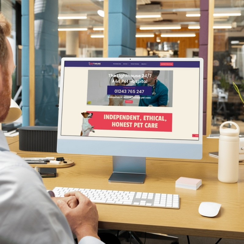 Computer screen mockup presenting The Lighthouse Vets website layout.