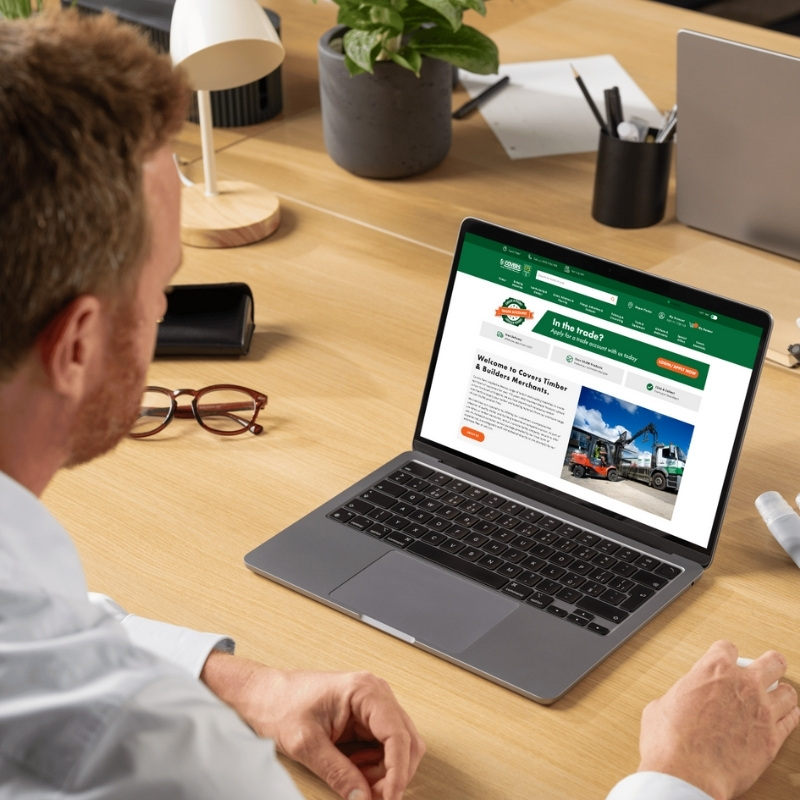Laptop mockup showcasing the Covers Timber & Builders Merchants website homepage.
