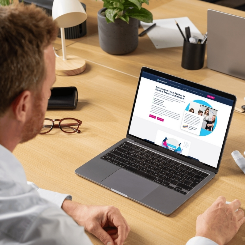 Laptop screen mockup showcasing the Documation website homepage.