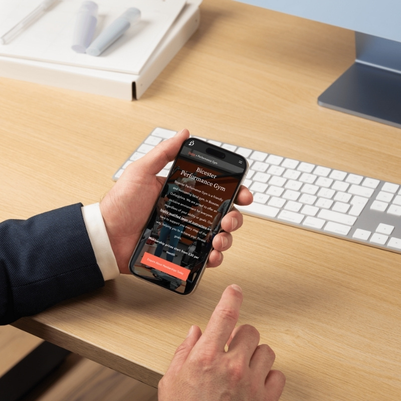 Mobile phone mockup displaying the Bicester Gym website homepage.