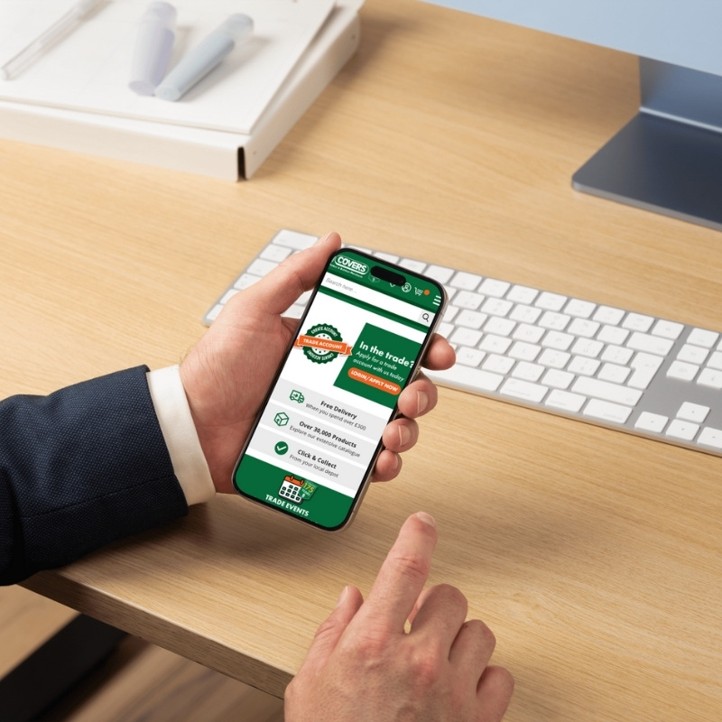 Mobile phone mockup displaying the Covers Timber & Builders Merchants website homepage.