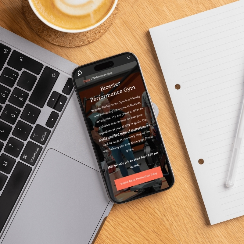Smartphone screen mockup showing the Bicester Gym website design.