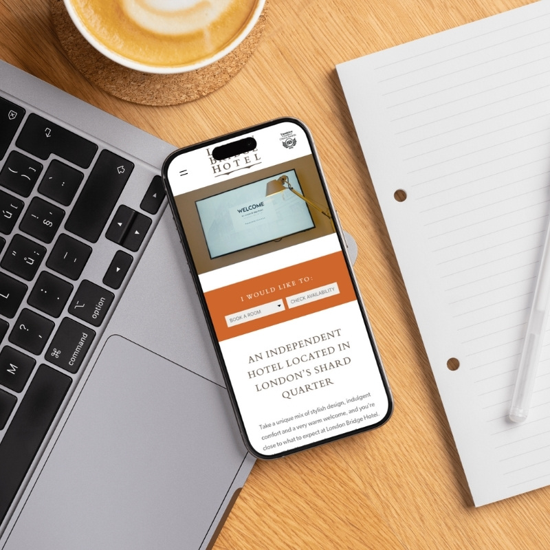Smartphone screen mockup showing the London Bridge Hotel website design.