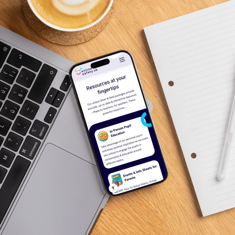 Mobile phone screen mockup displaying the Online Safety UK website.