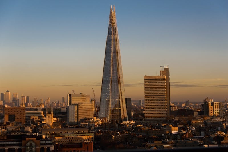 The Shard skyscraper in London against a clear sky.