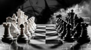 Chess board with white hat and black hat pieces